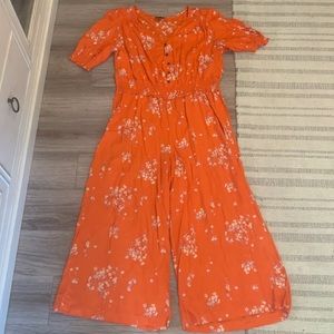 Orange floral jump suit